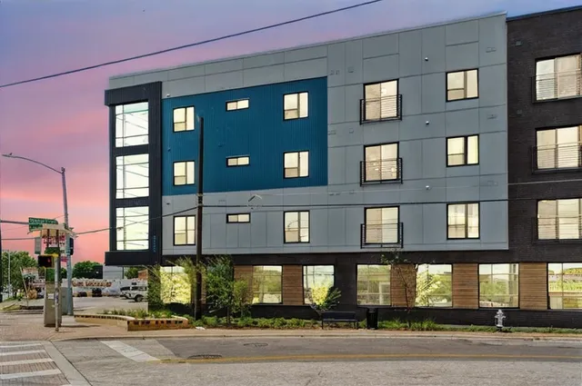 a front view of a building with a street