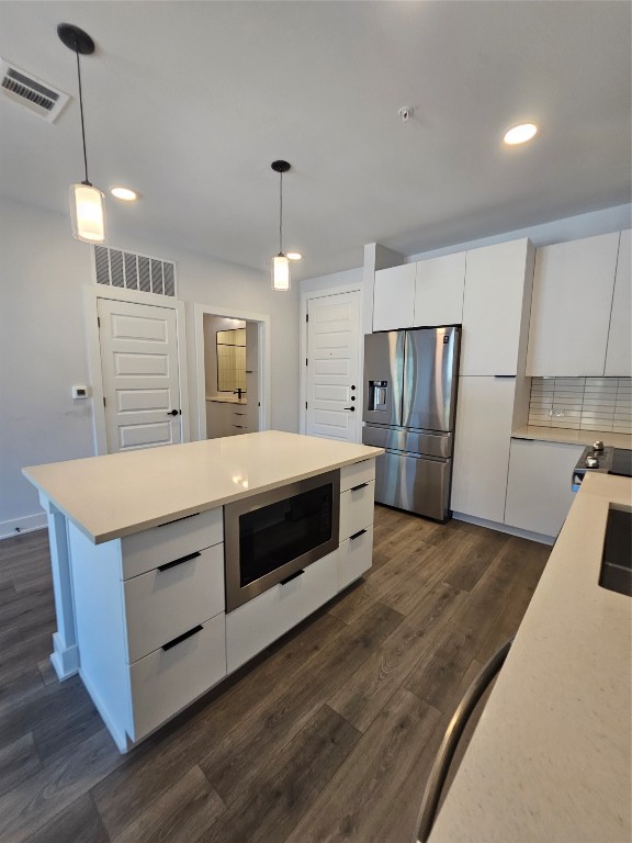 2220 Webberville Road, Unit 310 Austin, TX 78702 - Photo 13 of 39 a kitchen with stainless steel appliances a refrigerator and a sink