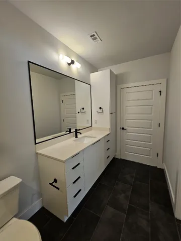 a bathroom with a sink and mirror