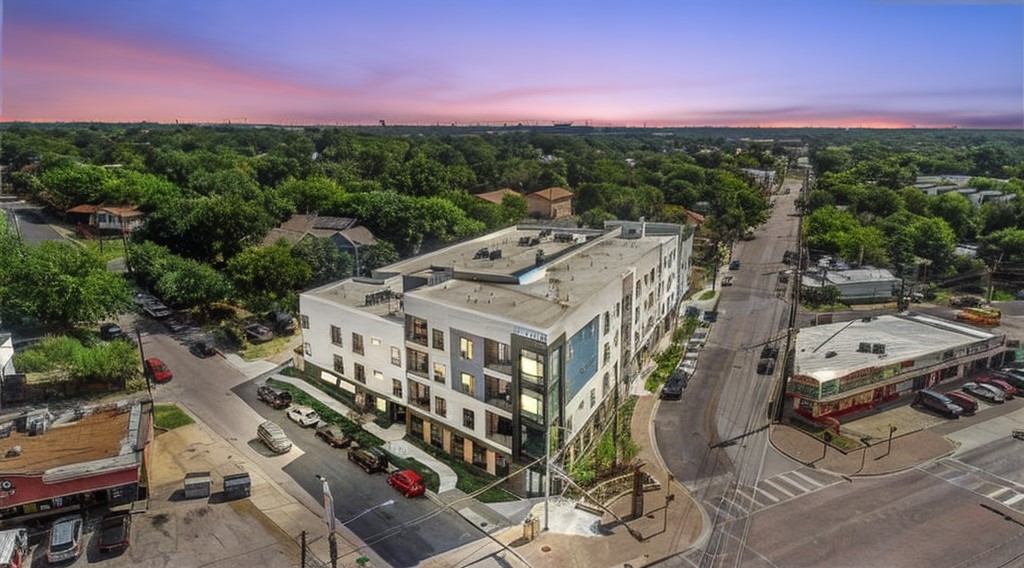 2220 Webberville Road, Unit 310 Austin, TX 78702 - Photo 2 of 39 a view of a city with tall buildings