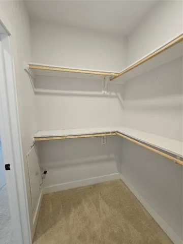 a view of an empty walk in closet