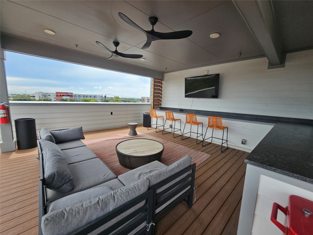 2220 Webberville Road, Unit 310 Austin, TX 78702 - Photo 30 of 39 a living room with furniture and a flat screen tv