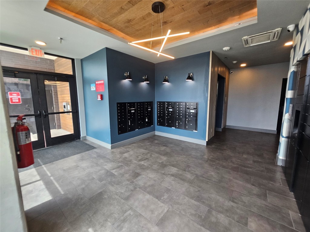 2220 Webberville Road, Unit 310 Austin, TX 78702 - Photo 31 of 39 a view of a hallway with livingroom