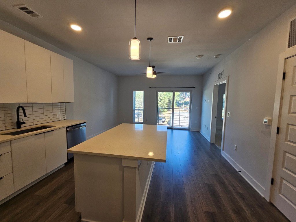 2220 Webberville Road, Unit 310 Austin, TX 78702 - Photo 7 of 39 a kitchen with sink and refrigerator