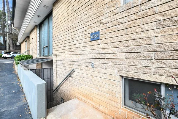 a view of a balcony with wooden floor and a ceiling fan