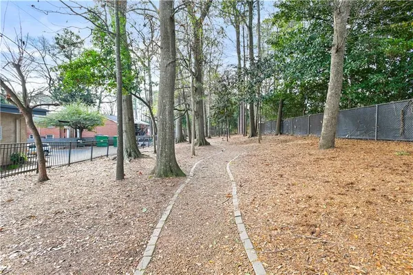 a backyard of a house with lots of trees