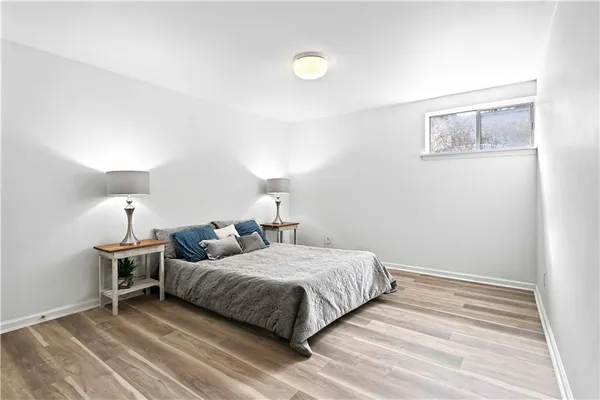 a bedroom with a bed and lamp