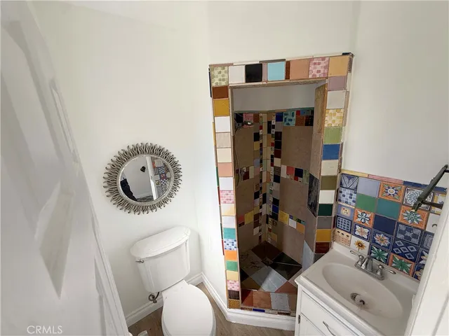 a bathroom with a toilet and a sink