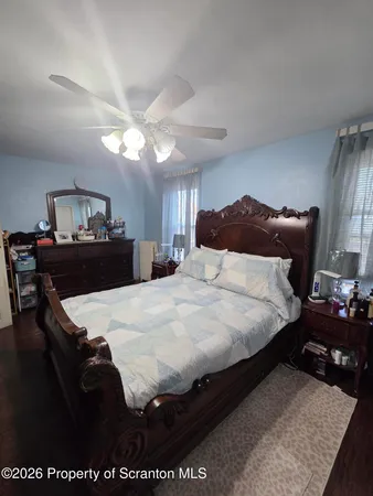 a bedroom with a bed and a table