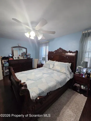 a bedroom with a bed and a table