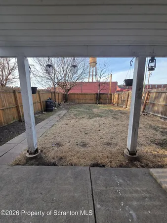 a view of a car park front of house