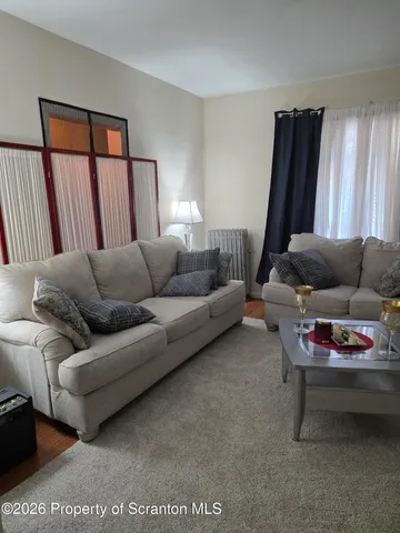 a living room with furniture and a couch