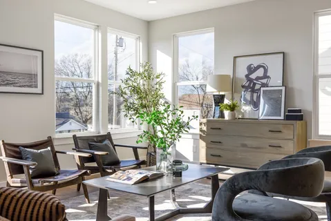 a living room with furniture and a large window