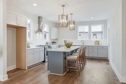 a kitchen with a sink cabinets and window