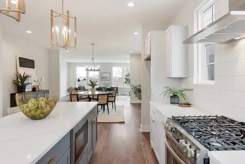 a kitchen with a table and chairs