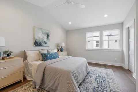 a bedroom with a large bed and a window