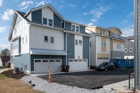 a front view of a house with sitting area