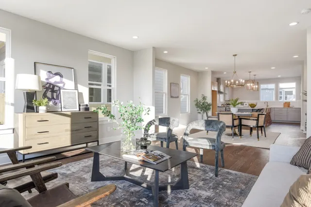 a living room with furniture a dining table and a piano table