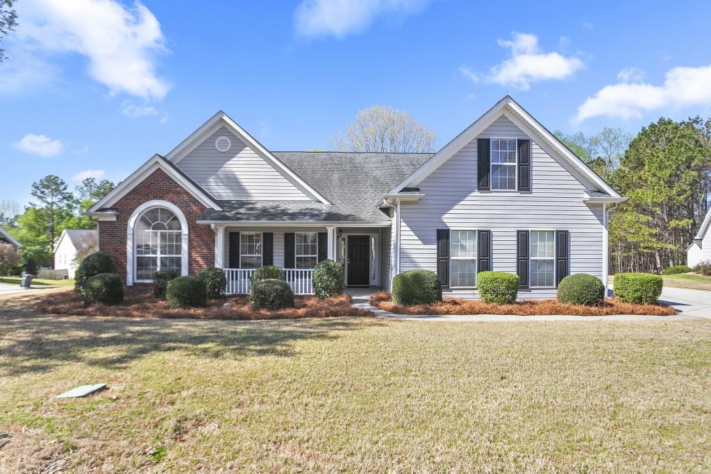 a front view of a house with a yard