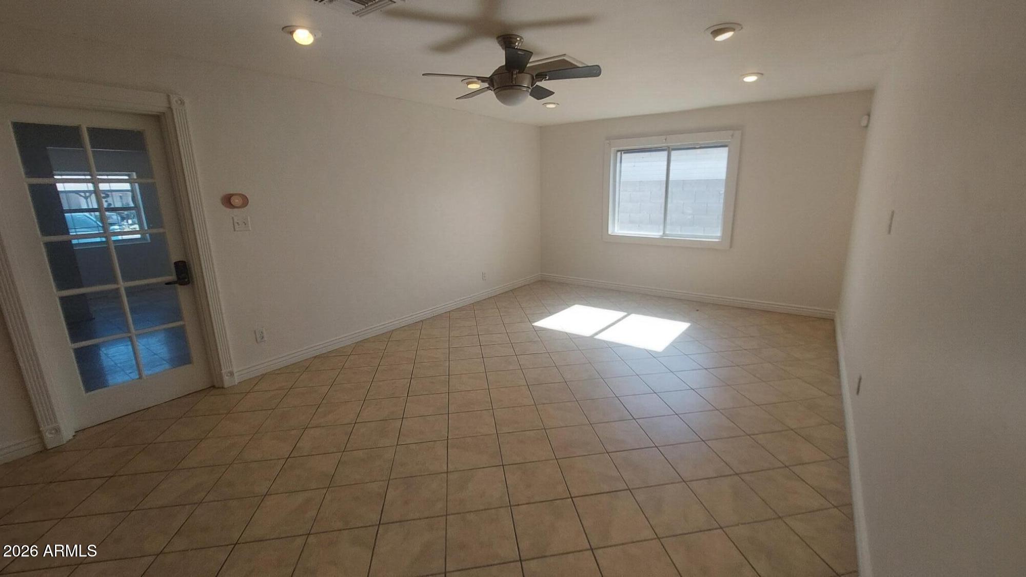 2448 West Freeway Lane Phoenix, AZ 85021 - Photo 7 of 27 a view of an empty room and window