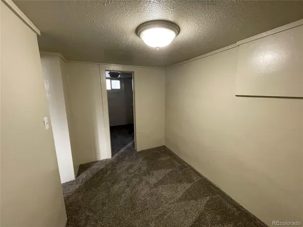 an empty room with a hallway