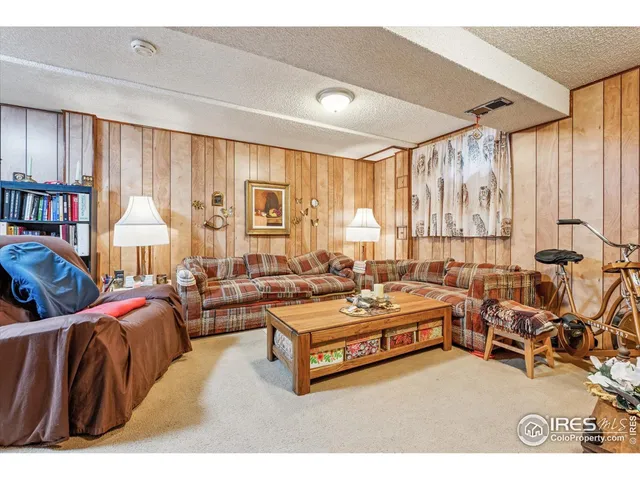 a spacious bedroom with two beds and a large window