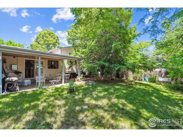 a view of a house with a yard porch and sitting area