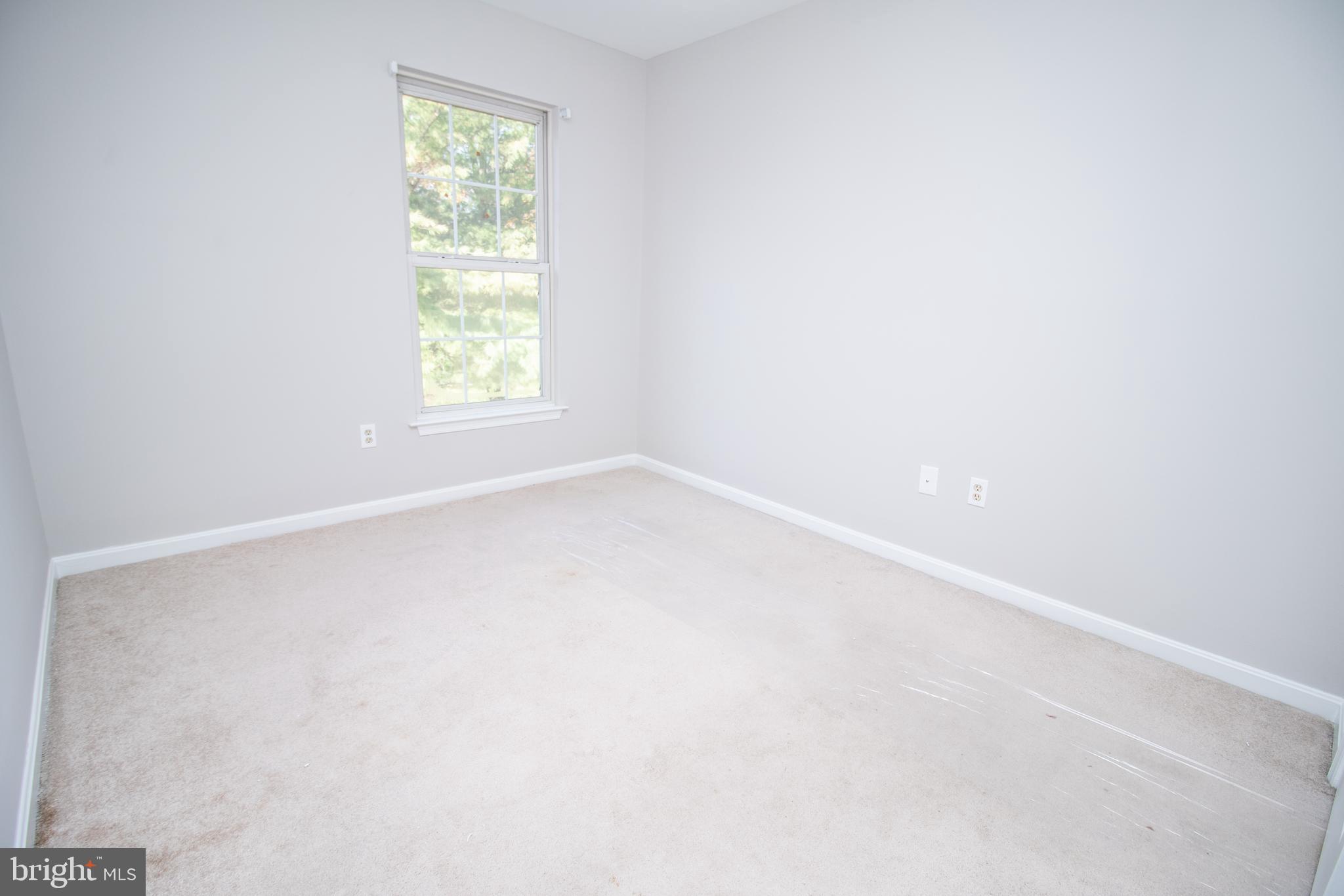 7708 Scatteree Road Severn, MD 21144 - Photo 17 of 41 an empty room with a window