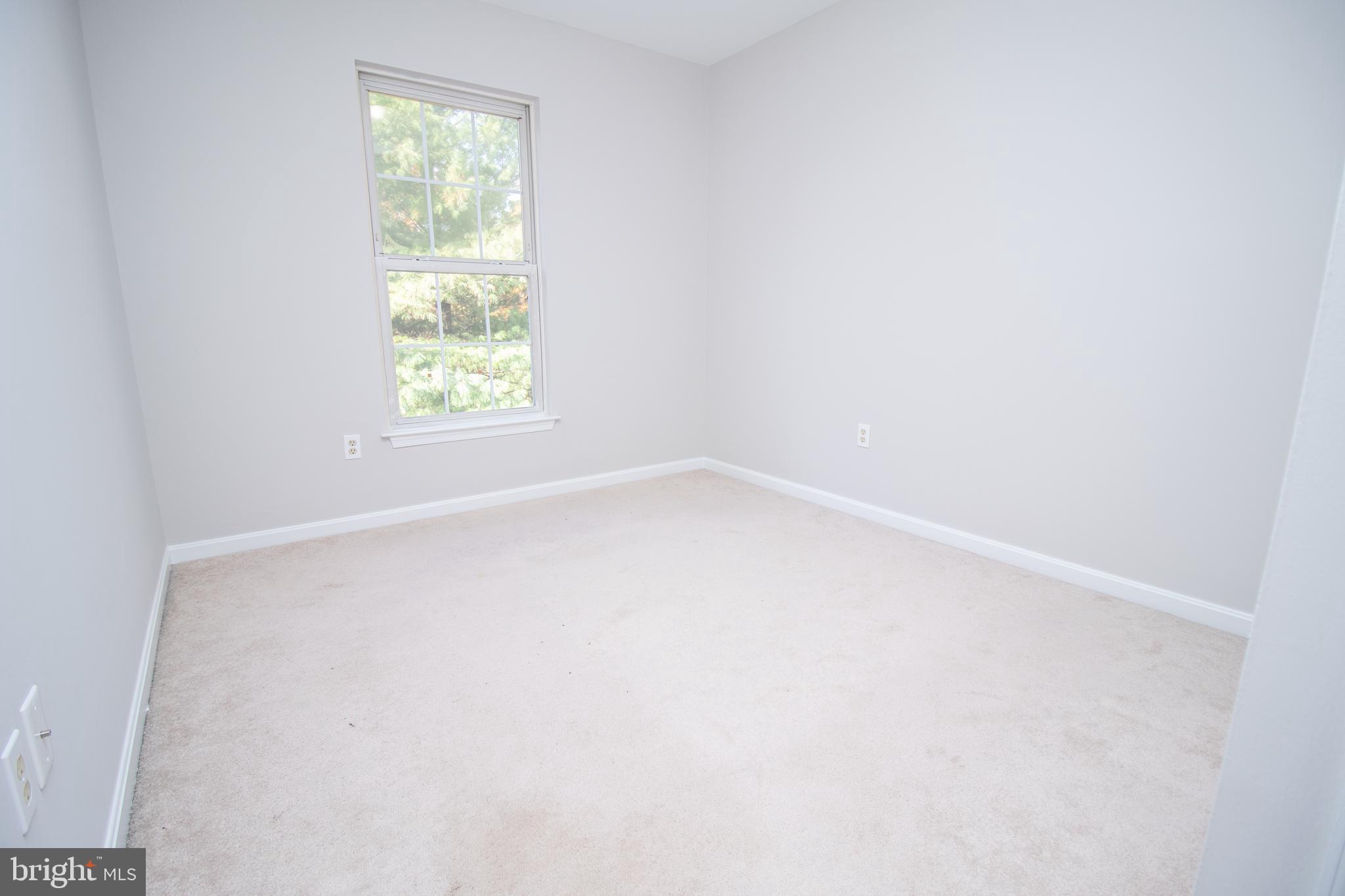 7708 Scatteree Road Severn, MD 21144 - Photo 20 of 41 an empty room with a window