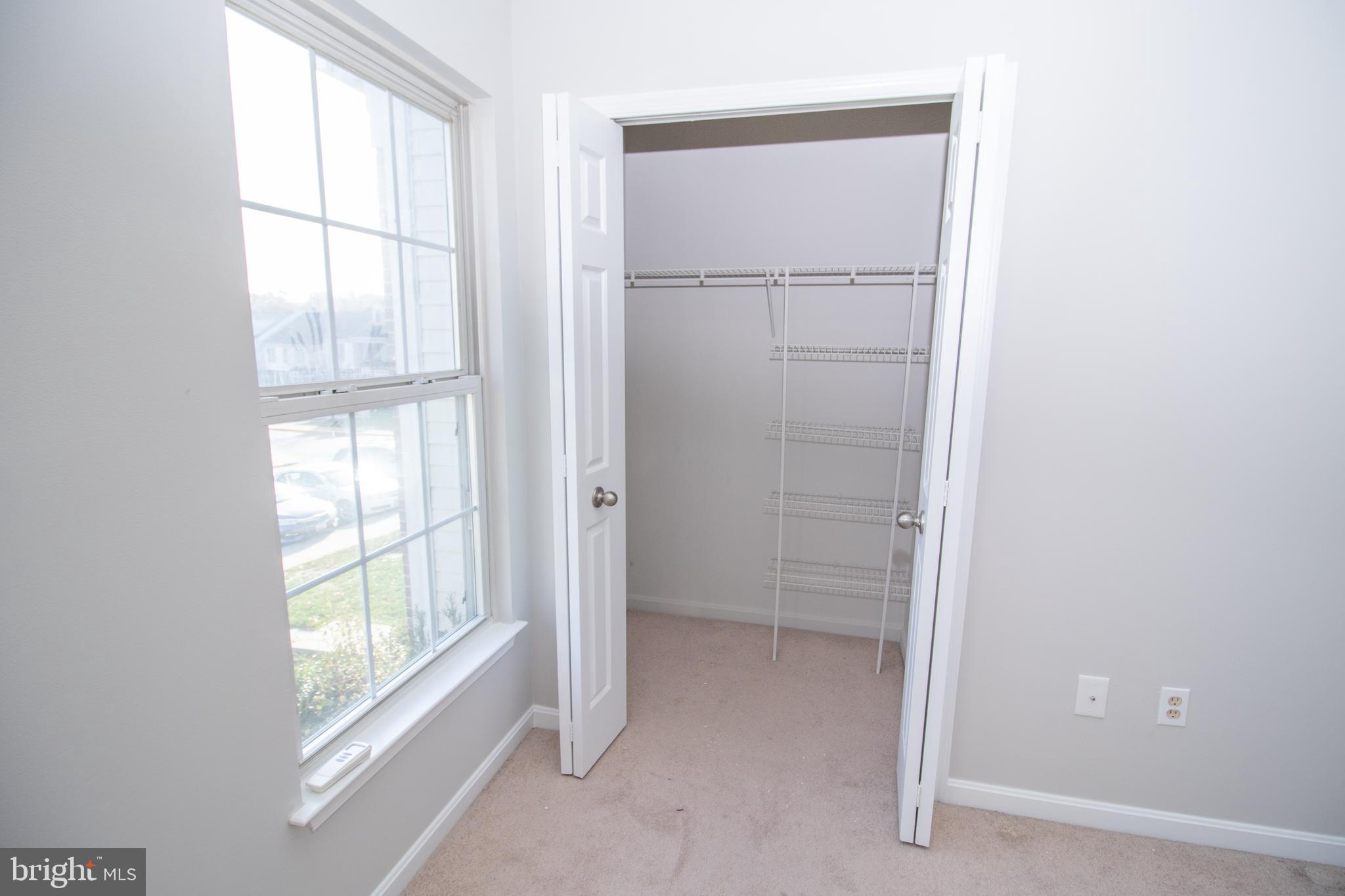 7708 Scatteree Road Severn, MD 21144 - Photo 25 of 41 a view of an empty room with a window