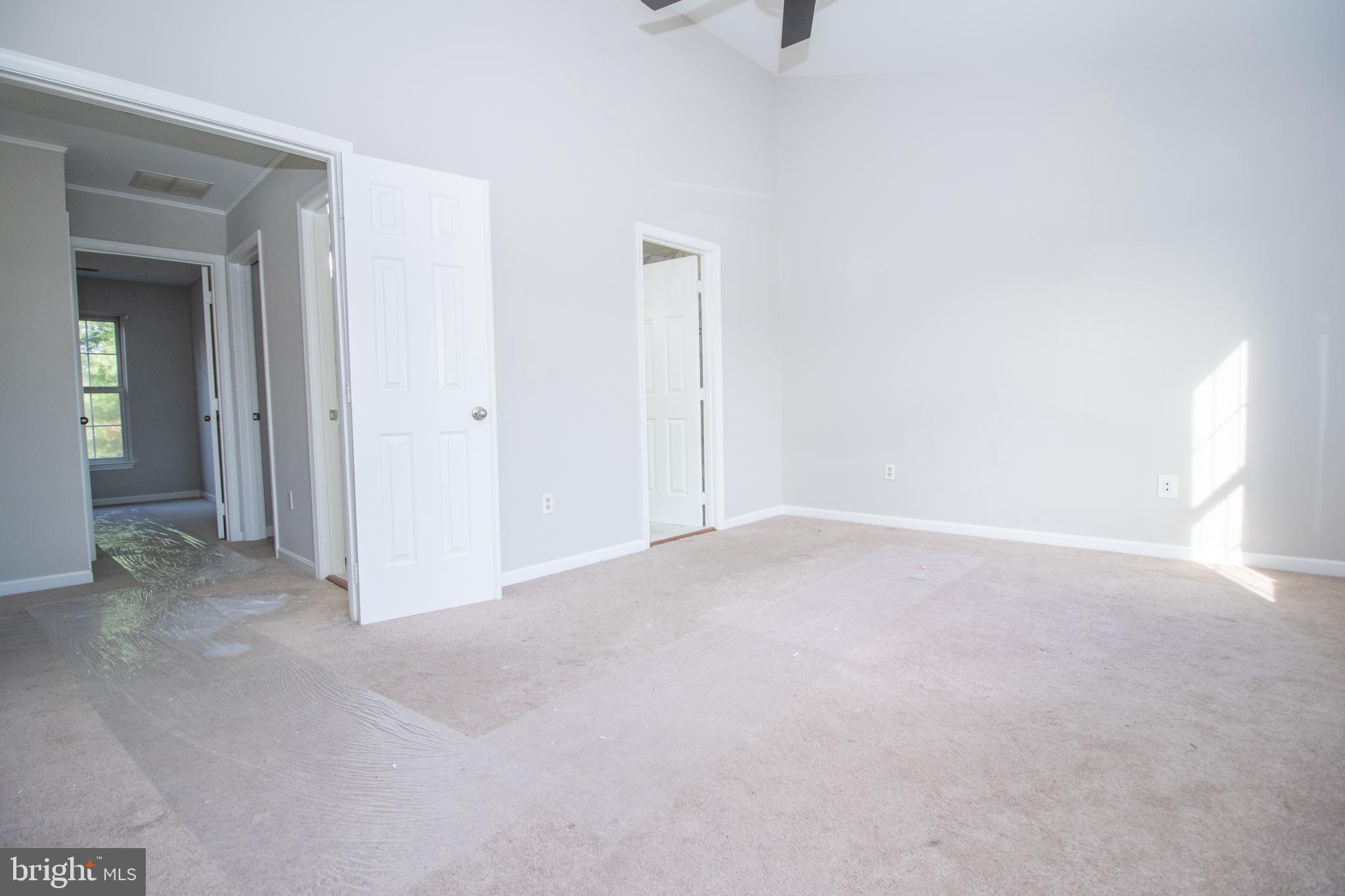 7708 Scatteree Road Severn, MD 21144 - Photo 26 of 41 a view of an empty room and a window