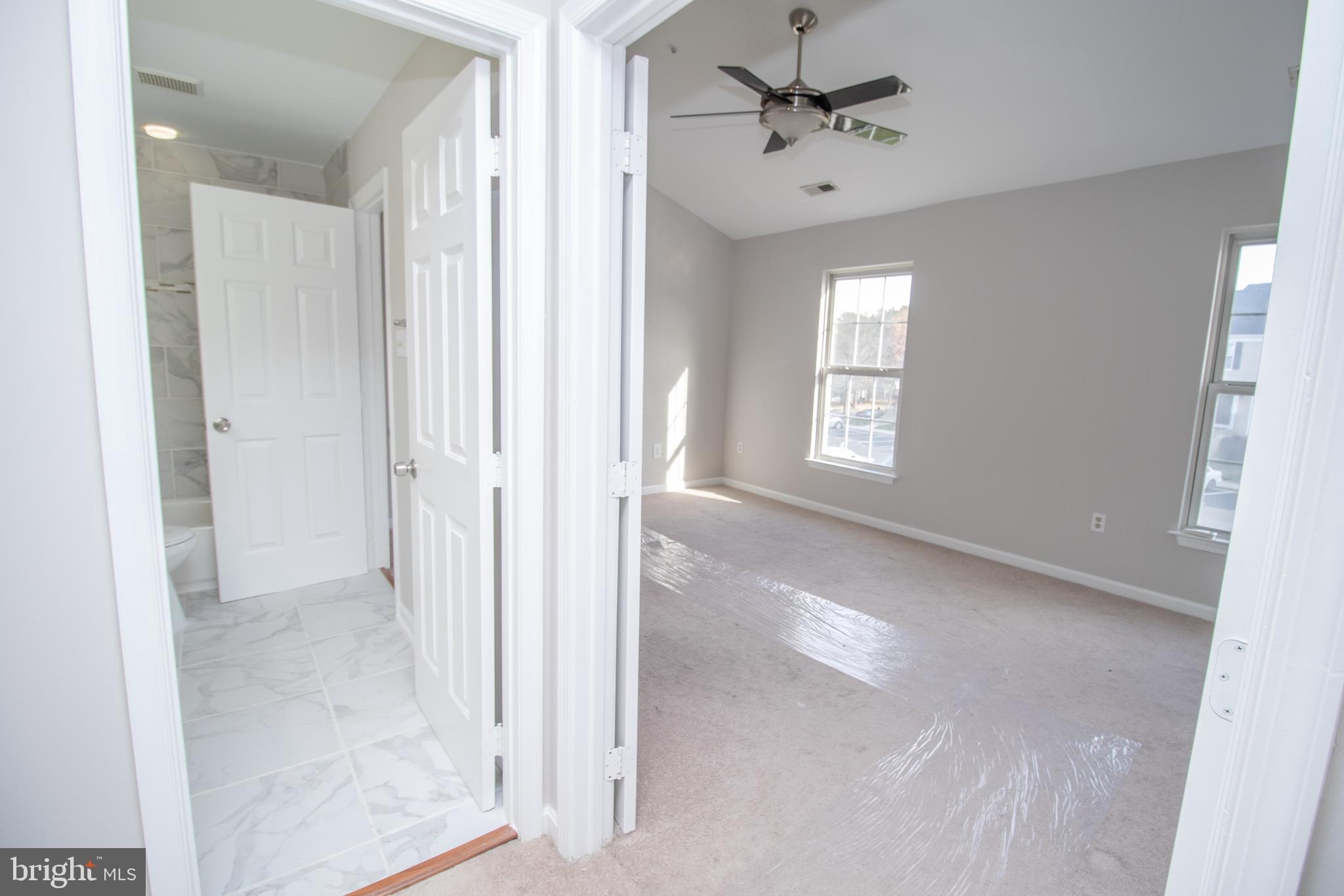 7708 Scatteree Road Severn, MD 21144 - Photo 28 of 41 a view of an empty room with a window