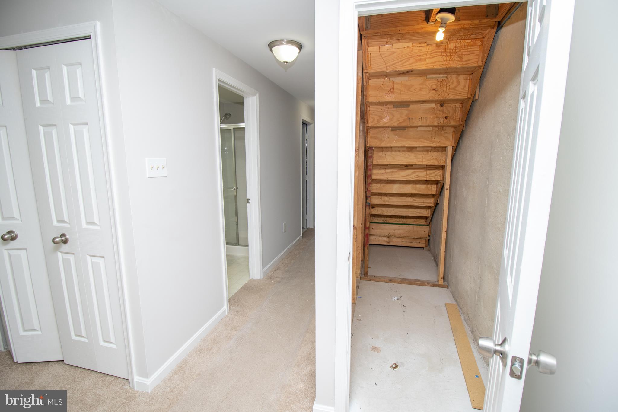 7708 Scatteree Road Severn, MD 21144 - Photo 34 of 41 a view of a hallway with wooden floor and entryway