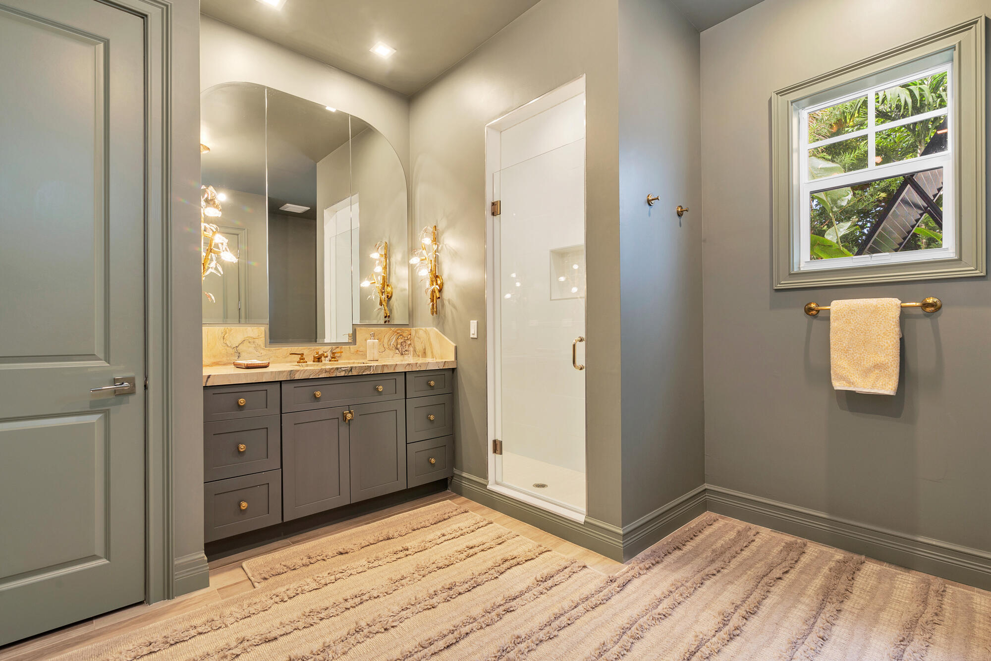 140 Edmor Road West Palm Beach, FL 33405 - Photo 13 of 30 a spacious bathroom with a granite countertop sink mirror and a shower