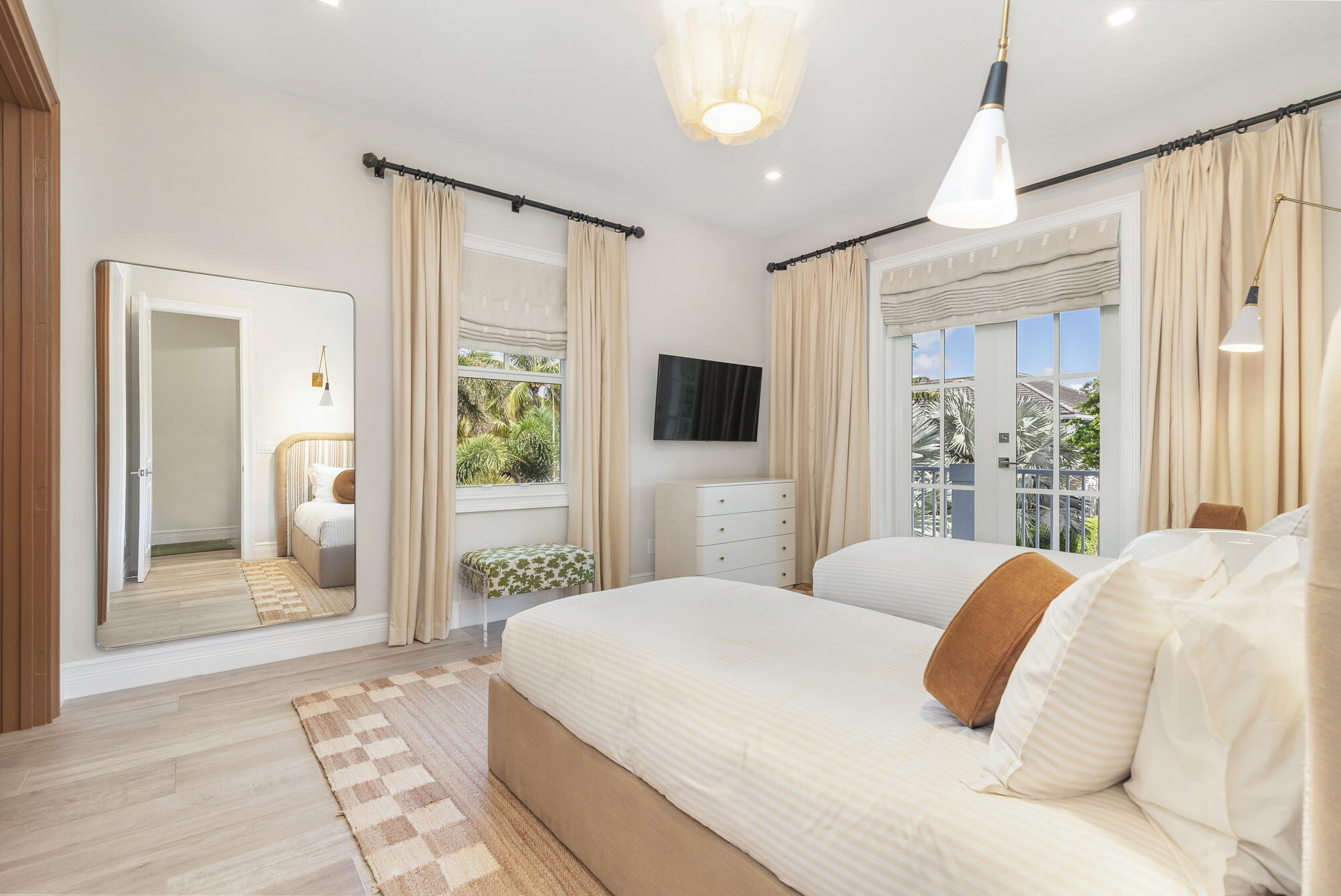 140 Edmor Road West Palm Beach, FL 33405 - Photo 17 of 30 a bedroom with a large bed and a flat tv screen