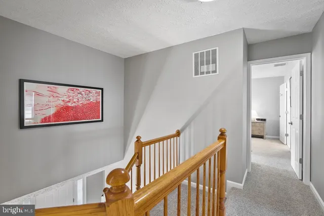 a view of a hallway with staircase