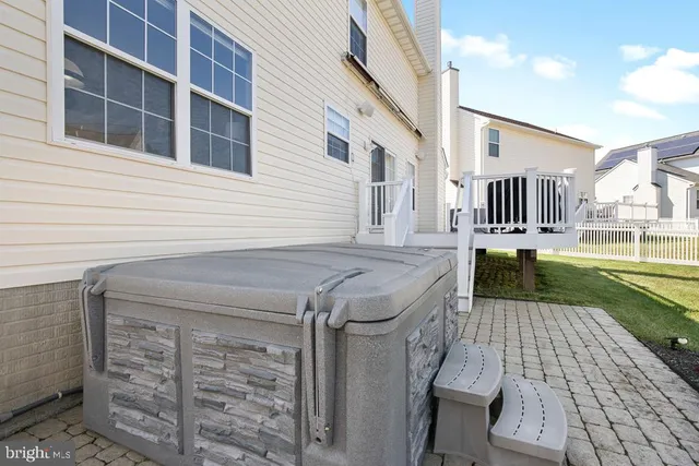 a view of a patio with table and chairs
