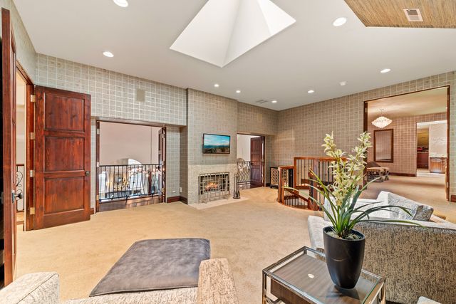 a bedroom with furniture and a chandelier