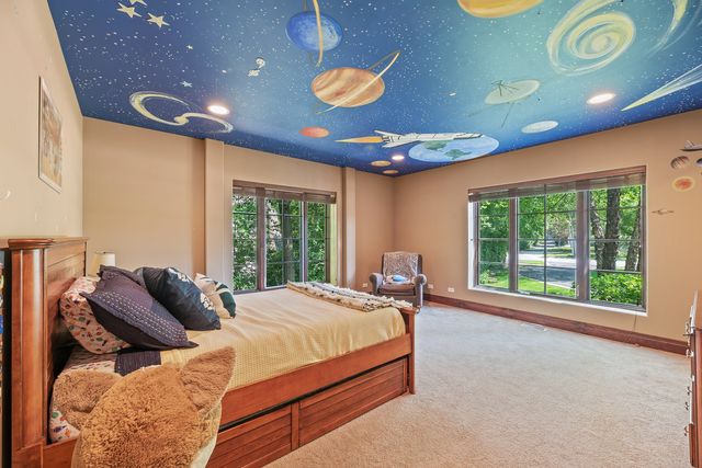 a bathroom with a granite countertop sink a toilet and a shower