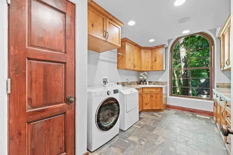 a kitchen with a sink and a large window