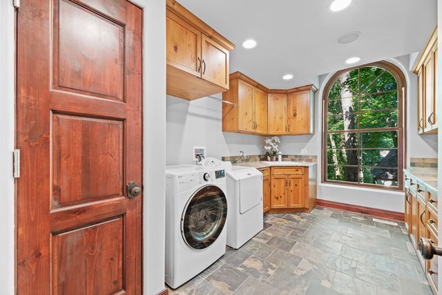a kitchen with a sink and a large window