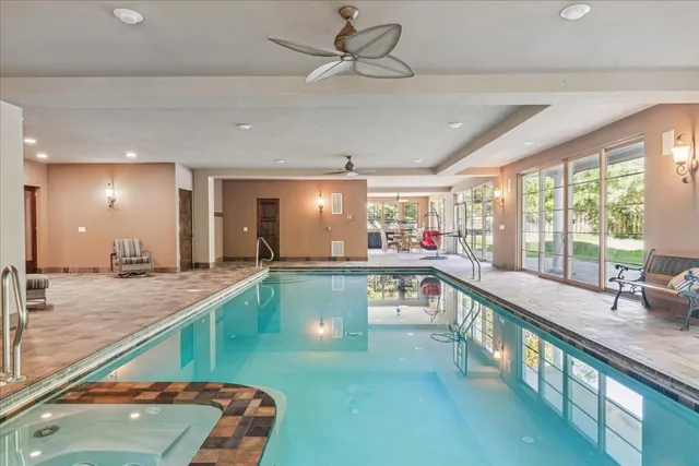 a view of a swimming pool and wooden floor