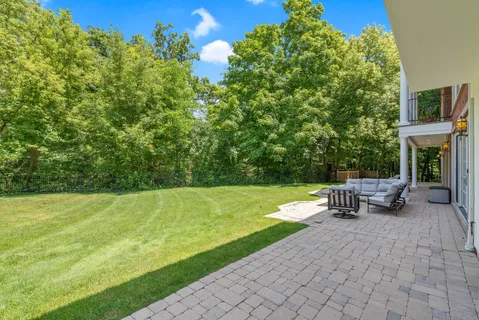 a view of a grassy field with trees