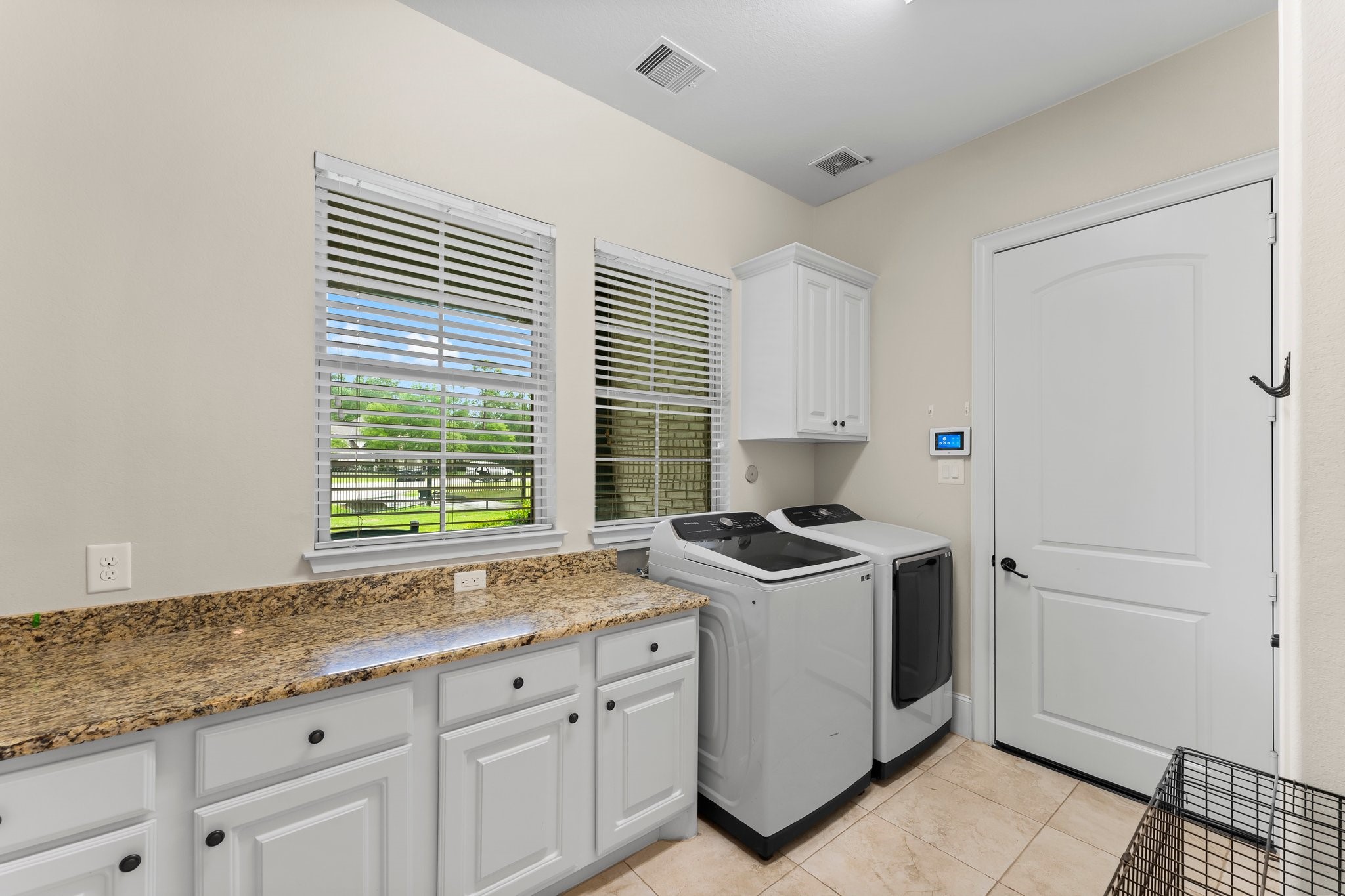 5006 Newport Court Spring, TX 77386 - Photo 16 of 46 a kitchen with granite countertop a sink stove and cabinets