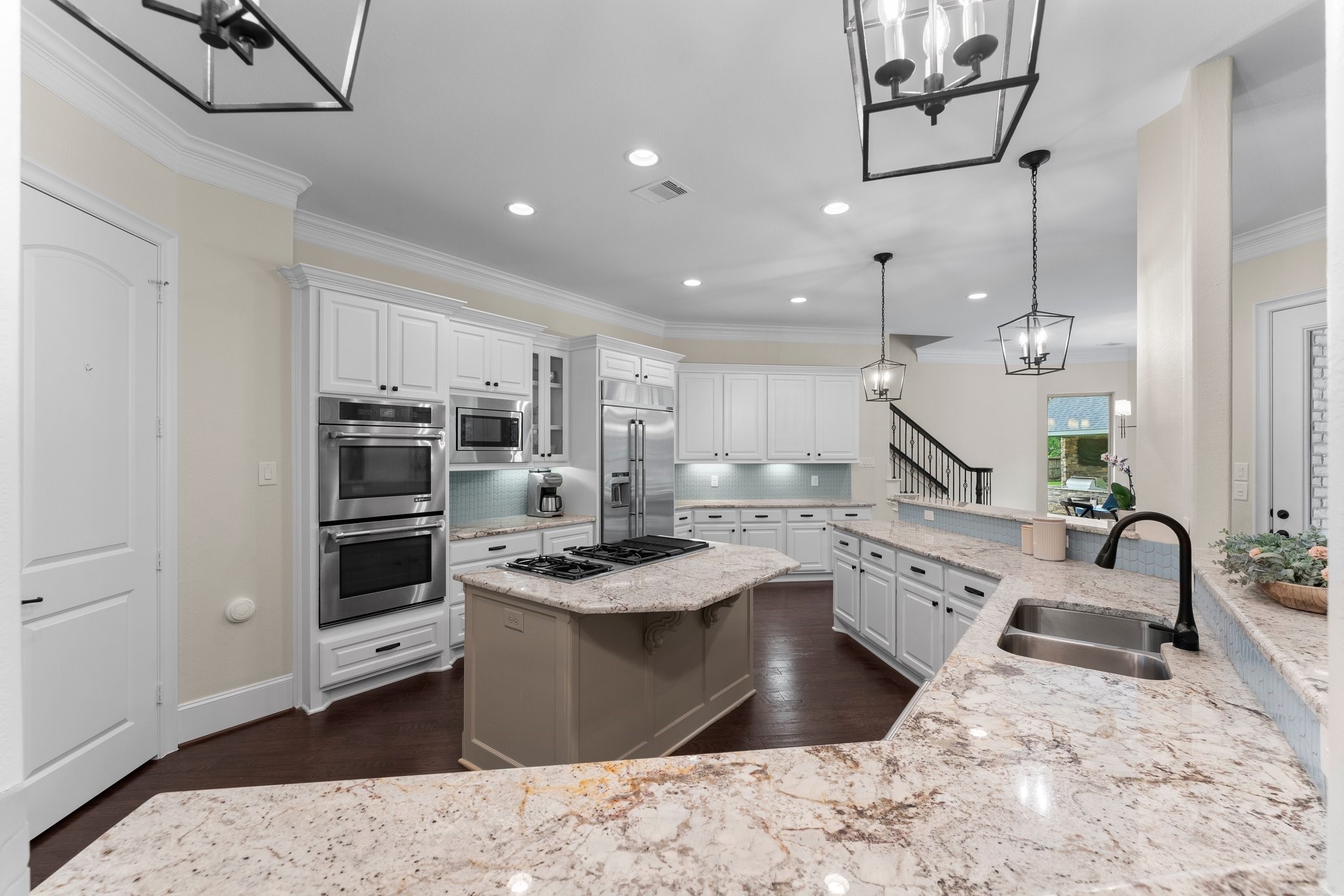 5006 Newport Court Spring, TX 77386 - Photo 19 of 46 a kitchen with stainless steel appliances granite countertop a sink stove and refrigerator