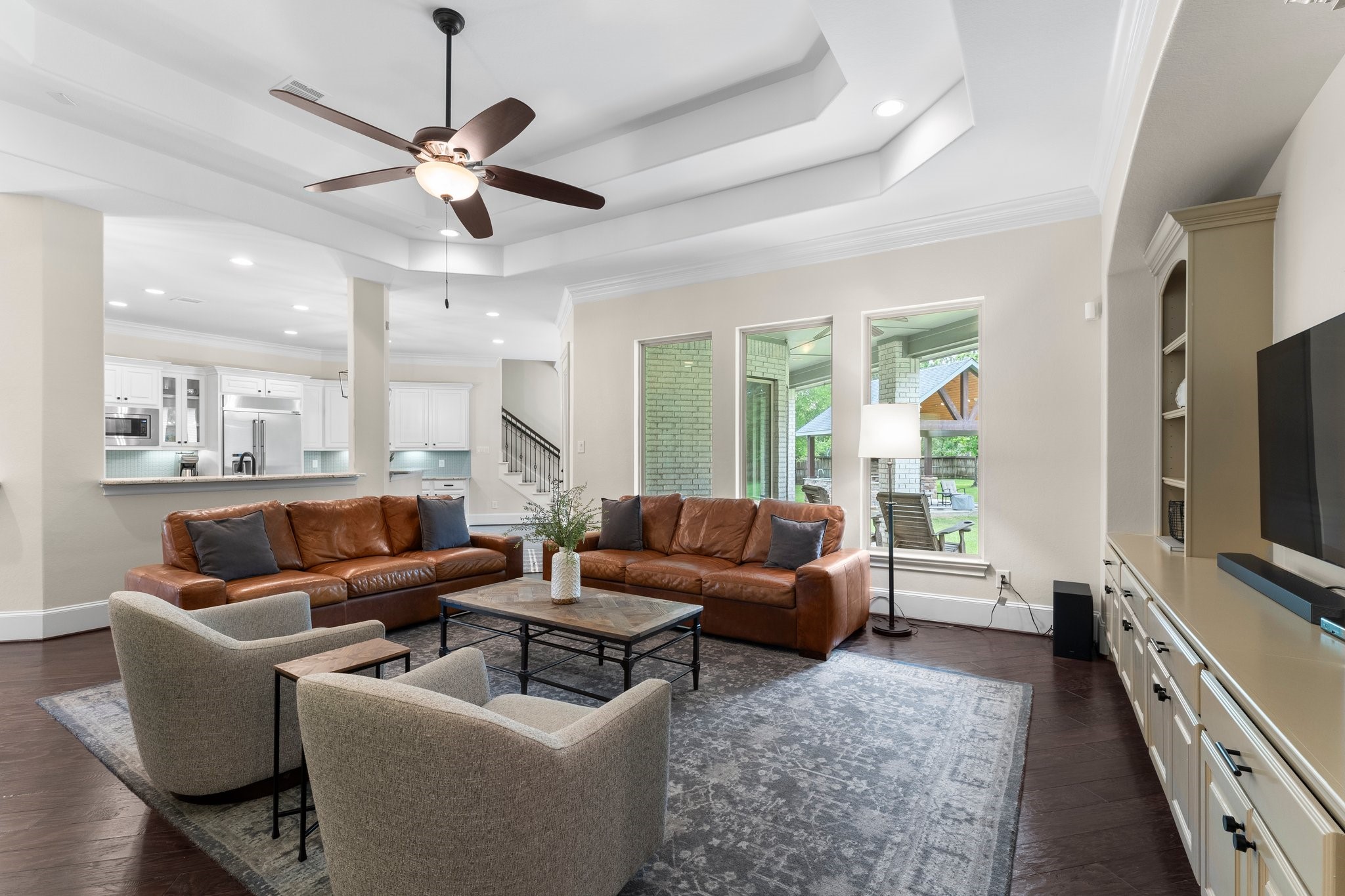 5006 Newport Court Spring, TX 77386 - Photo 27 of 46 a living room with furniture and a flat screen tv