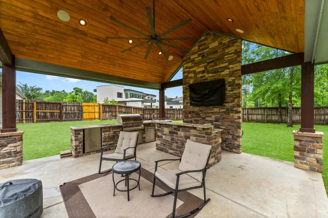 a view of a patio with a table and chairs