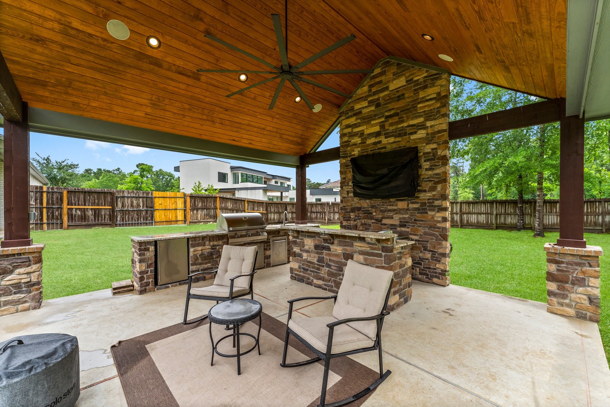 5006 Newport Court Spring, TX 77386 - Photo 40 of 46 a view of a patio with a table and chairs