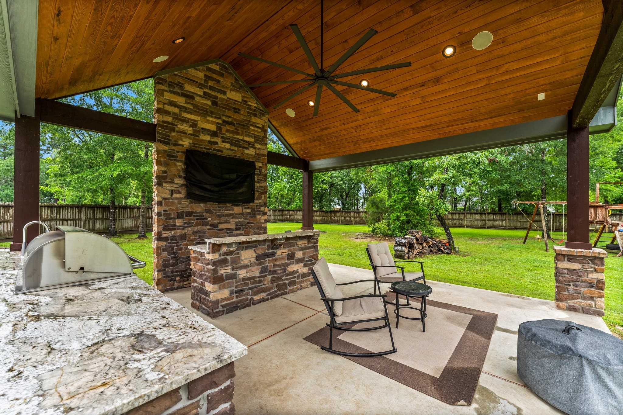 5006 Newport Court Spring, TX 77386 - Photo 41 of 46 a view of a chairs and table in the patio