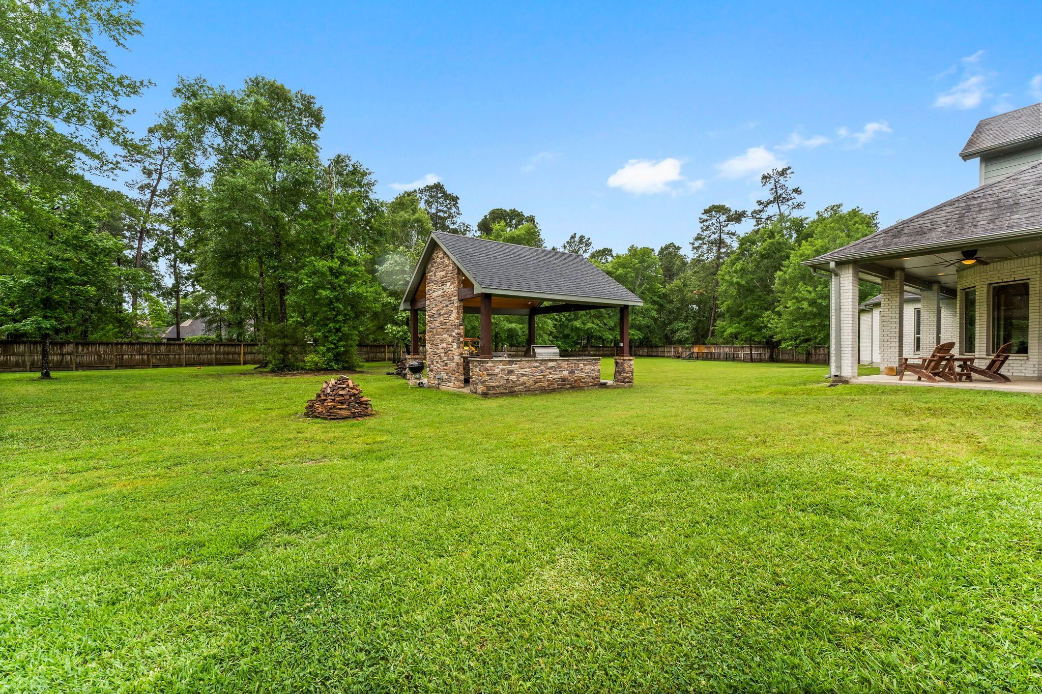 5006 Newport Court Spring, TX 77386 - Photo 45 of 46 a view of a house with a backyard porch and sitting area
